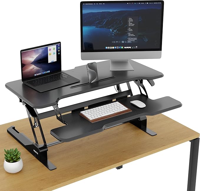 Mount-It! Height Adjustable Standing Desk Converter, 38” Wide, Stand Up Desk Riser for 2 Monitors, Manual Gas Spring Desktop Raises to 16.9", Fits Two Monitor Screens with Keyboard Mouse Tray in Black